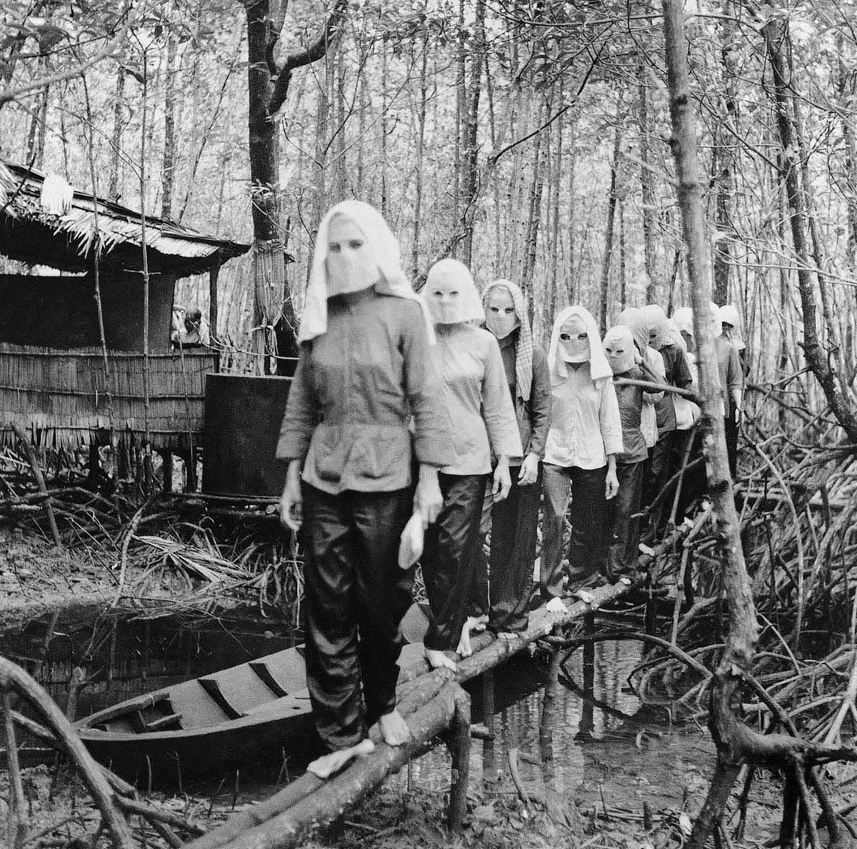 Activists (presumably pro-DRV) wearing masks to hide their identities in case of capture and interrogation, Vietnam, 1972