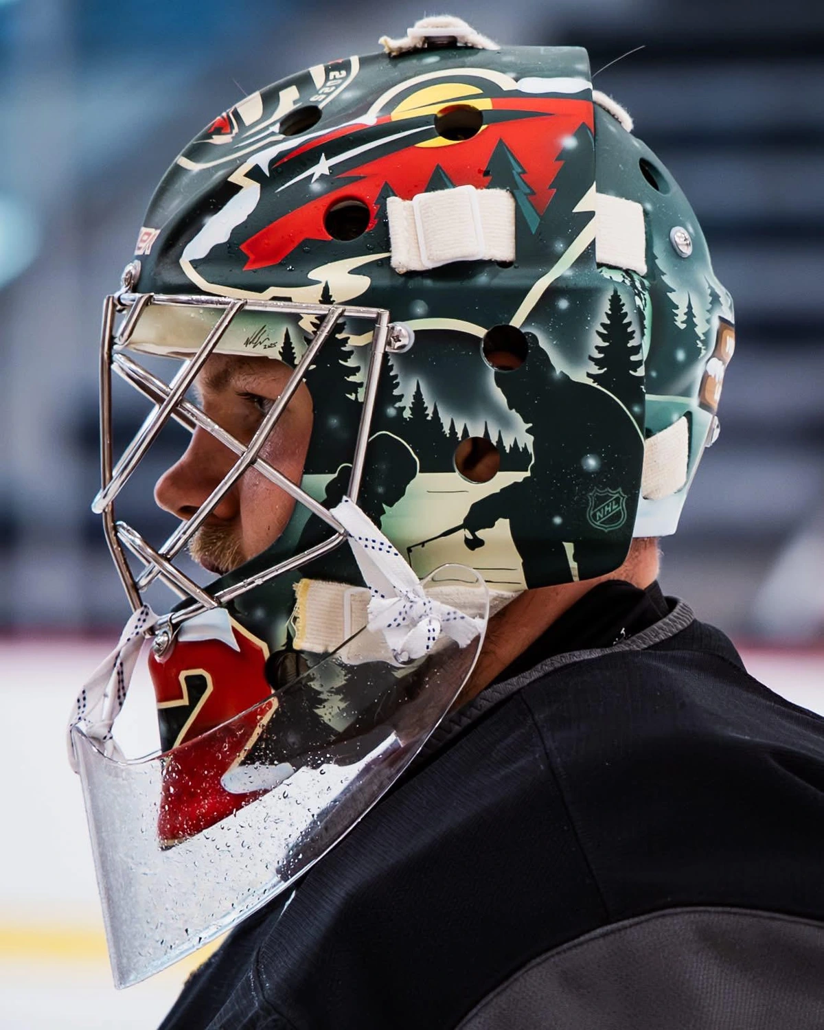 Picture of Gustavssons helmet including a father and son icefishing