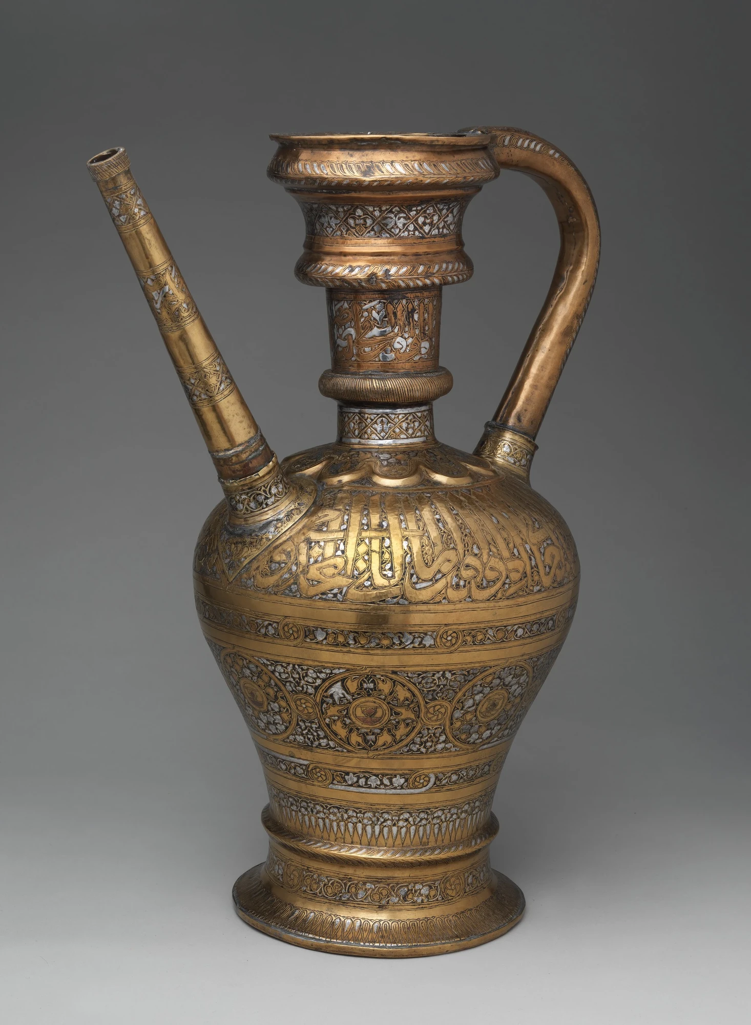 Ornate brass pitcher from the Mamluk Sultanate, modern-day Egypt, 14th century AD