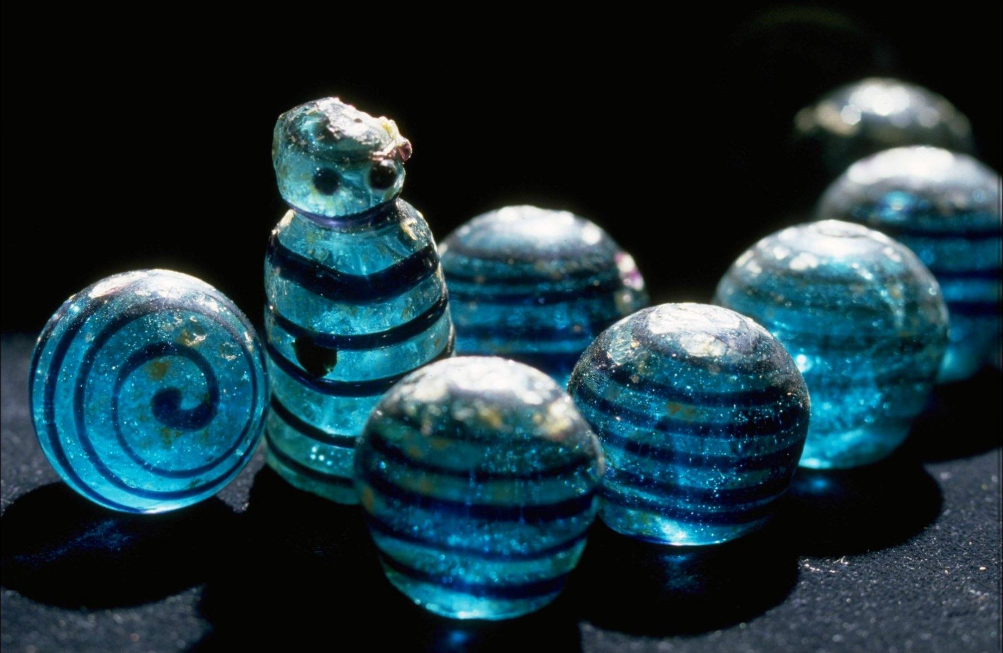 Norse game pieces, blue glass, Sweden, 800 AD - 1100 AD