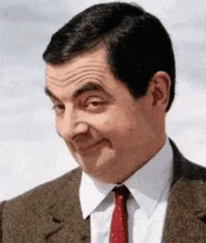 rowan atkinson wagging his eyebrows suggestively