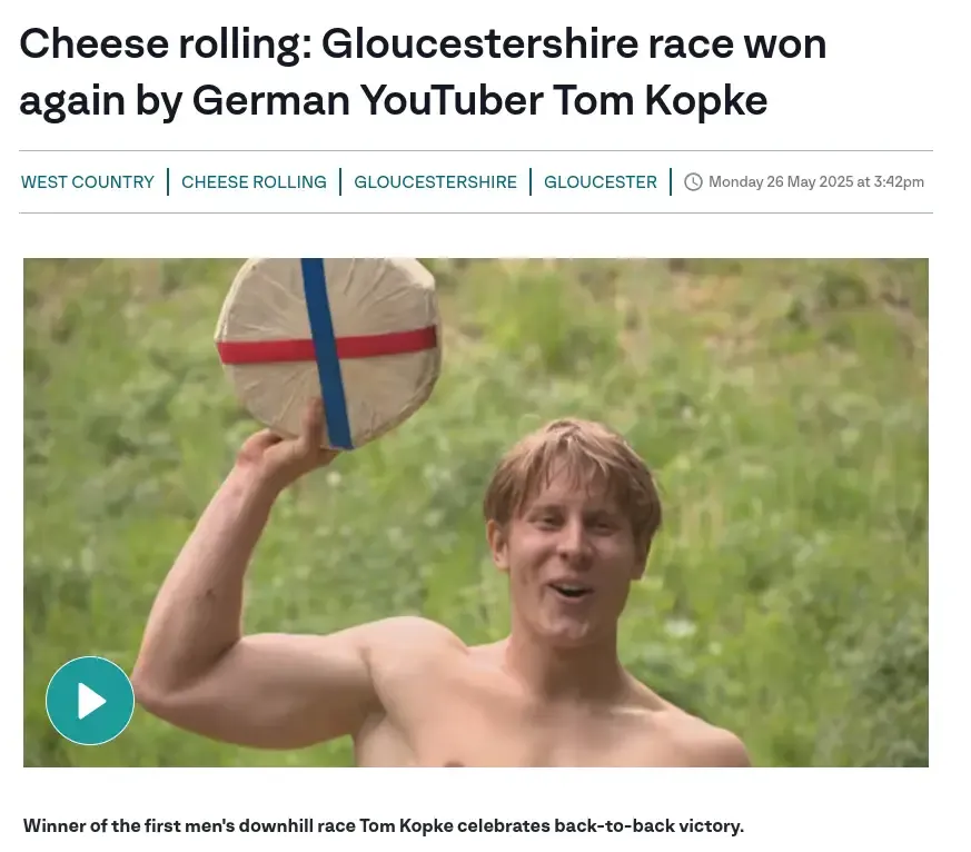 News headline: "Cheese rolling: Gloucestershire race won again by German YouTuber Tom Kopke" with a picture of a shirtless man holding up a wrapped wheel of cheese.