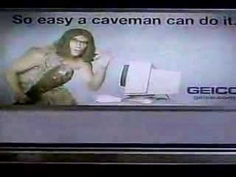 Screenshot of classic Geico TV ad where sign says So Easy A Caveman Could Do It