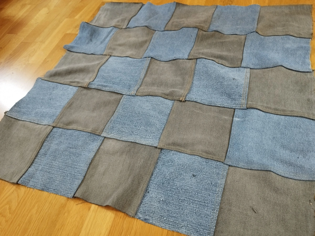 jeans material sewed in a rough quilt checkerboard