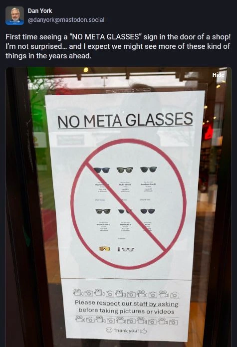 Screenshot of a post by @danyork on Mastodon, his alt: A sign on a store window indicates "NO META GLASSES," featuring images of different sunglasses models. It also includes instructions to respect staff by asking permission before taking pictures or videos, with a friendly "Thank you!" at the bottom.