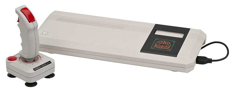 A Commodore 64GS console based on the C64 with a white Cheetah Annihilator joystick
