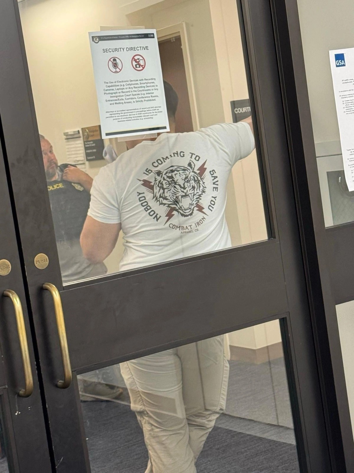 ICE Agent at the Court in NYC Wears "Nobody is Coming to Save You" t-shirt when Clocking in for Work