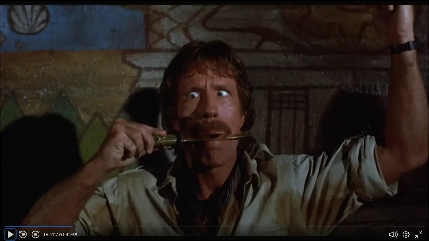 Firewalker - Max gurns with knife in his teeth