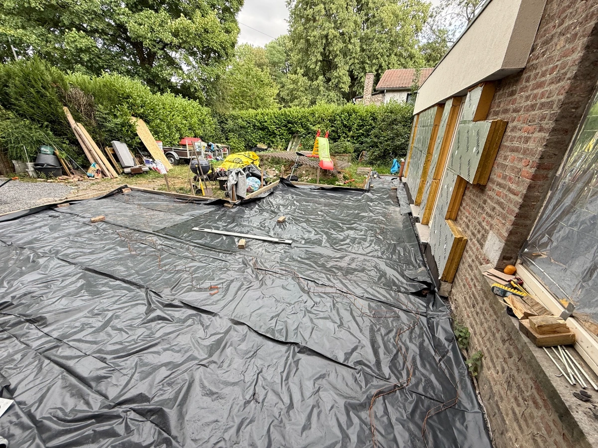 Membrane is placed over packed soil
