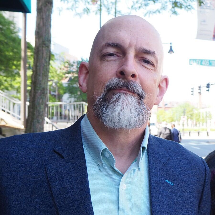 Neal Stephenson making a smug, "I told you so" face. At least, that's what I imagine he's trying to convey. He predicted people who walked around wearing Smart Glasses and consuming tokens to get information about everything they looked at.