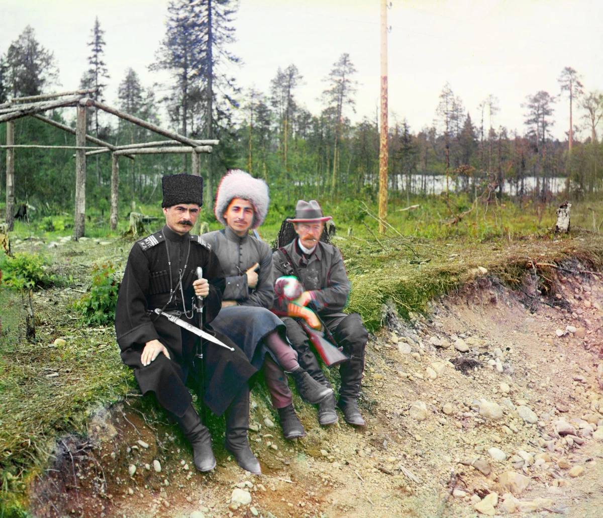 Early color photographer Sergei Prokudin-Gorskii and two Cossacks posing for a picture, 1916