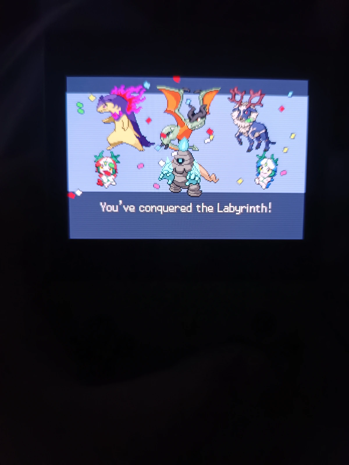 A picture taking of a handheld with a Hall of Fame screen, detailing a Typhlosion, Aerodactyl, Stantler, Plusle, Dusclops, and Minun 