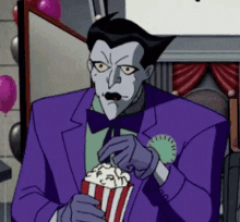 dc comics villain joker eating popcorn gif