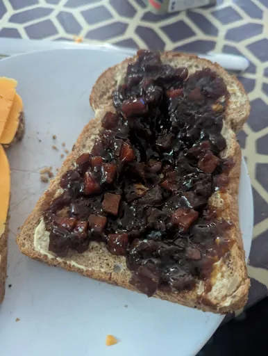 slice of bread with the perfect amount of branston on (a lot. cm thick perhaps?)