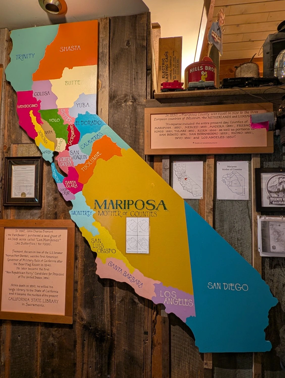 A display of a large map of California with the 1850 counties shown in different colors. Most notable are Mariposa and San Diego counties, which are much larger than their current extents and cover nearly half of the state.
