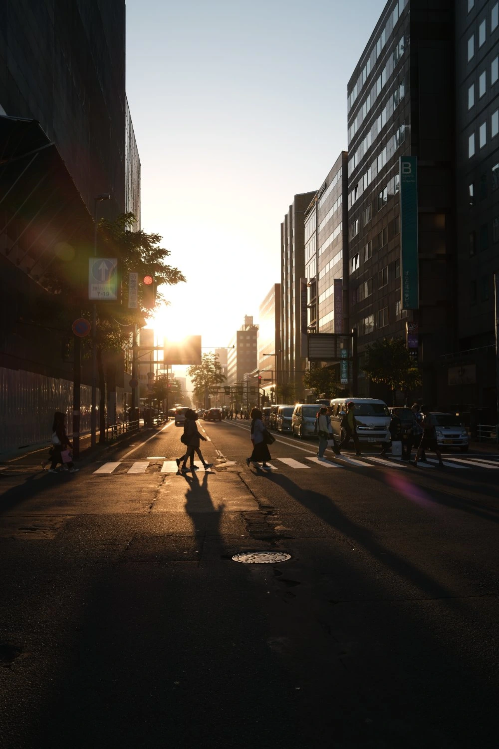 A crossing in Sapporo, Japan at sunset