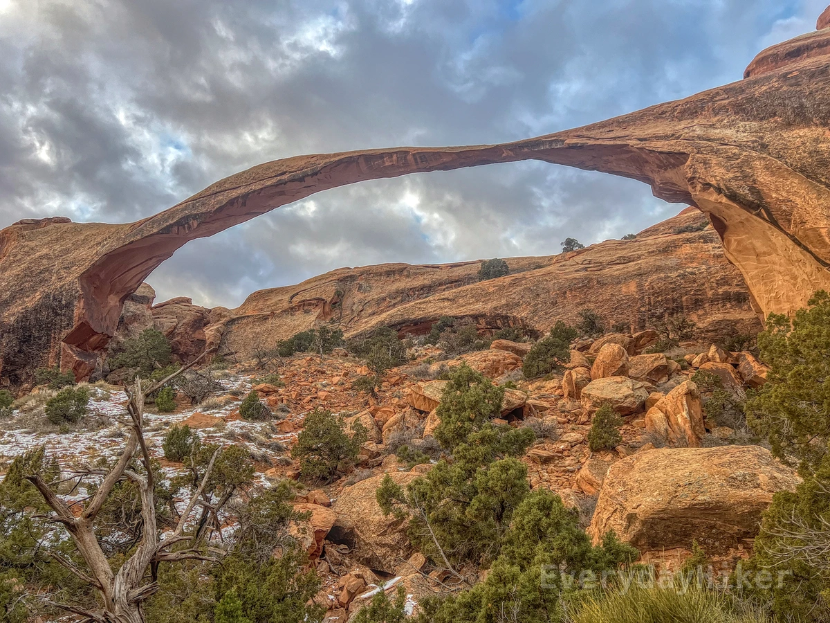 Looking up towards Landscape Arch with its needle-like land bridge, which is the longest in the park (306 ft at its widest). At only 6 ft in diameter at its thinnest, it was once thicker until a large portion came crashing down in the 1990s.  The rubble field may be seen below to the right.