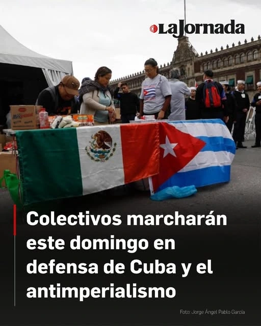 Text-photo with Cuba supporters in Mexico behind a table adorned with flags of Cuba and Mexico. 

Text reads: Colectivos marcharán este domingo en defensa de Cuba y el antimperialismo 