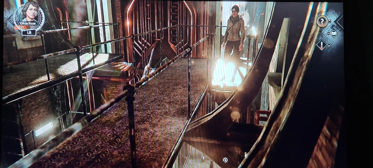 Photo of screen. Shows main character of Syberia: The World Before standing at the top of a ladder. The interaction point of the ladder appears well out of reach below. 