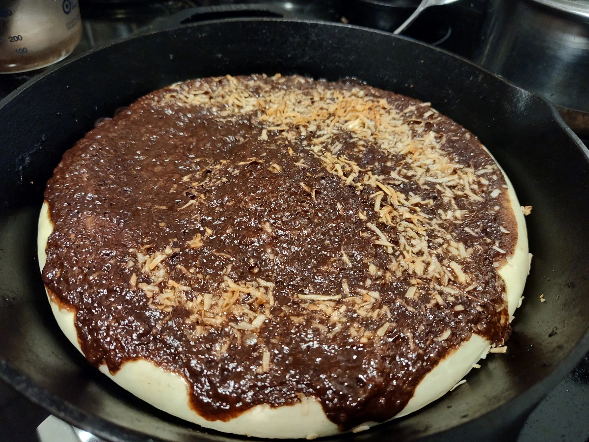 Pizza with chocolate sauce and coconut shreds