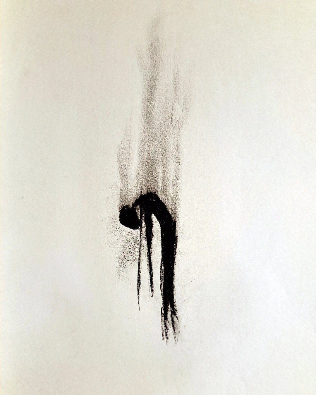 Charcoal smudge of a burned out person walking, smoke rising from the charred wisp of a figure.