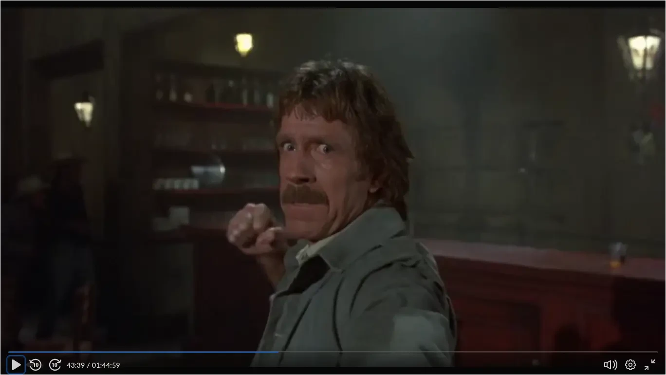 Firewalker - Max about to throw a punch right at the camera