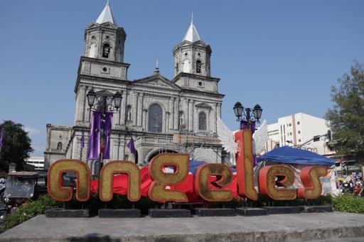 The word Angeles in front of a church.
