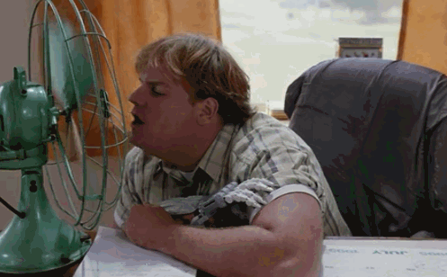 GIF animation of Tommy Boy scene where he stalks into desk fan