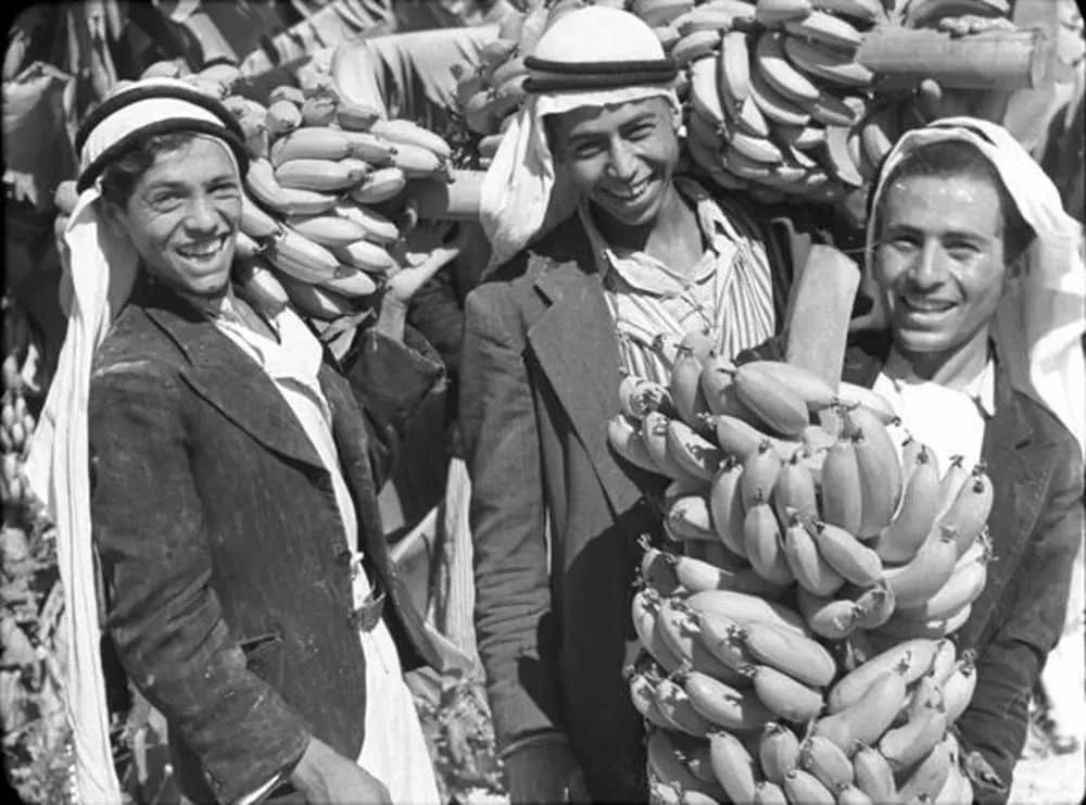 Palestinian men with bananas in Jericho, early 20th century