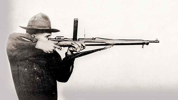 US soldier with a 'Pederson Device' to convert his bolt-action rifle into a semiautomatic, developed for WW1, 1918?