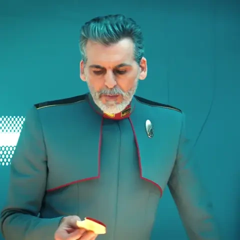 Admiral Vance taking a bite of an apple slice and saying "It's pretty good for shit"